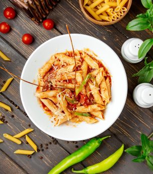 top view of penne pasta with tomato sauce and bell pepper top view of penne pasta with tomato sauce and bell pepper